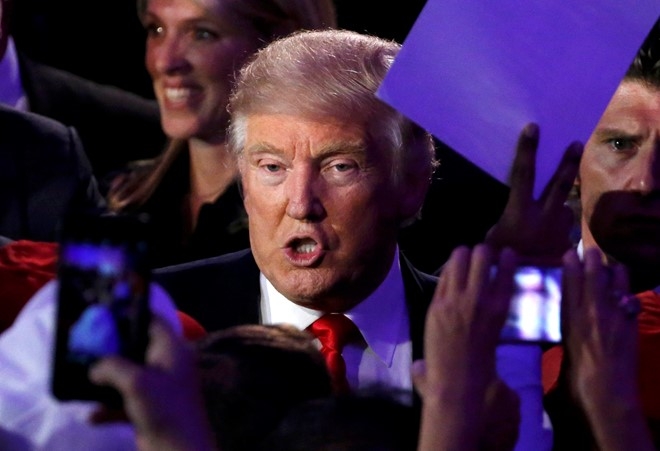 Tong thong dac cu Donald Trump sap ra toa hinh anh 1