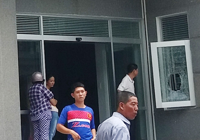 Nguoi dan ong chet trong phong bao ve cua toa nha vang chu hinh anh 1