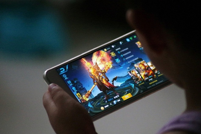 Trung Quoc lo so nghien game pha huy suc manh quan doi hinh anh 1